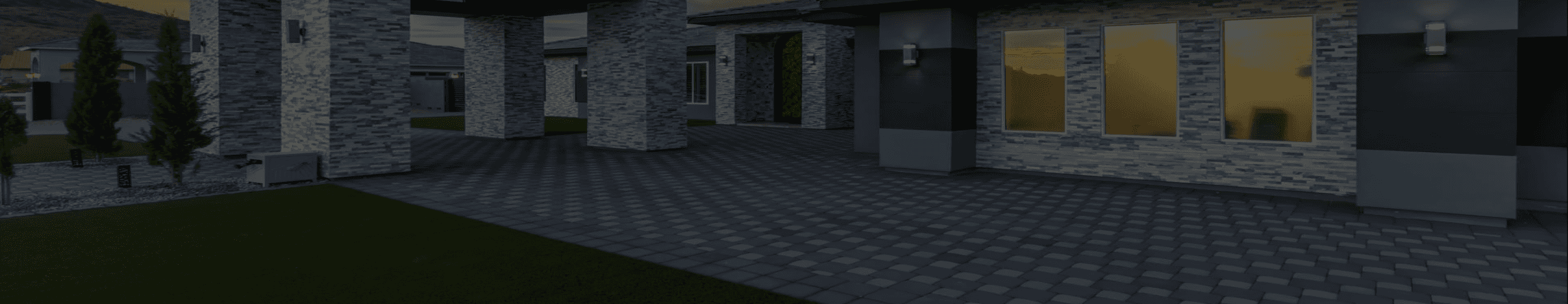 Exterior view of a modern house at dusk, featuring a paver driveway, artificial grass, stone veneer pillars, and windows reflecting the sunset.