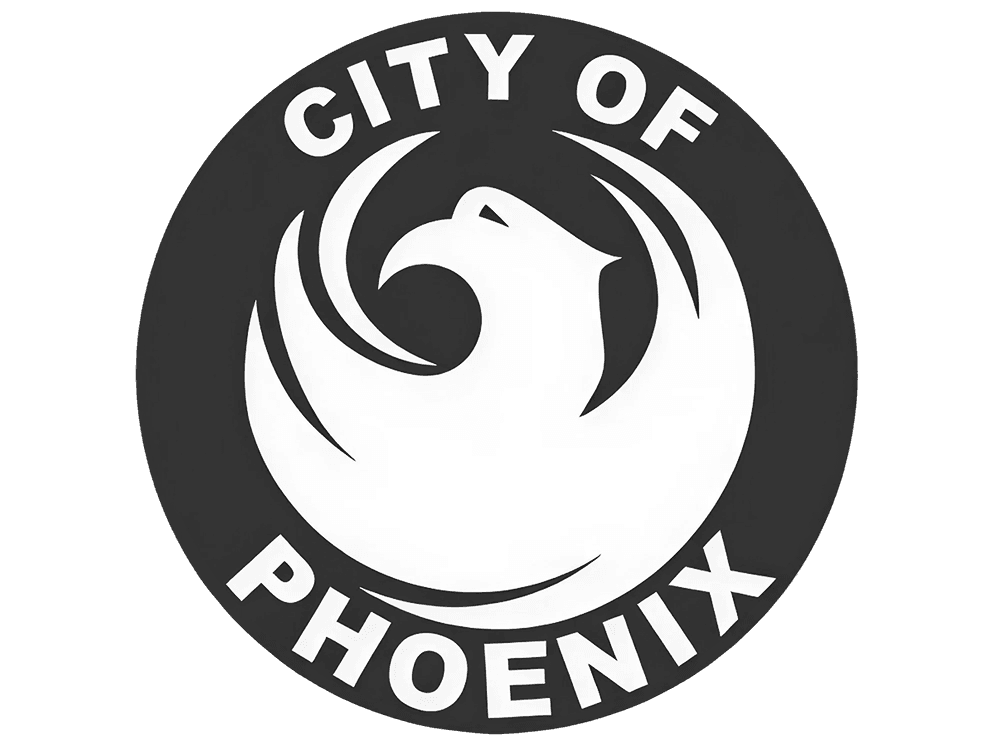 City of Phoenix logo: a white stylized phoenix bird on a dark gray circle, with the words 'CITY OF' above and 'PHOENIX' below.